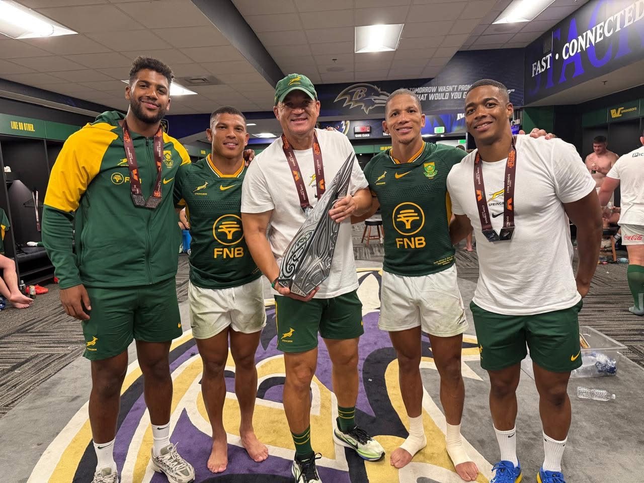 Springboks celebrate with the trophy in the Baltimore changing room