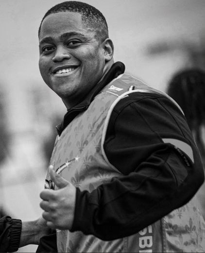 Luqobo Makwedini smiling and giving a thumbs-up